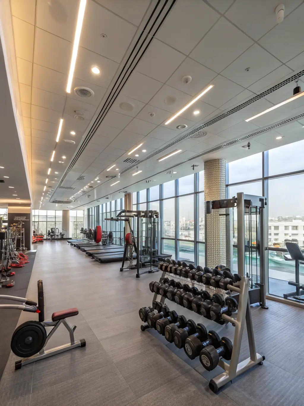 A modern gym interior with a dedicated space for red light therapy, showcasing the integration of GrowRx services within a fitness center.
